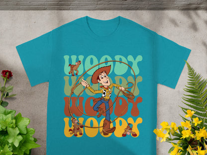 Woody from Toy Story on a teal t-shirt with "Woody" text and horse graphics.