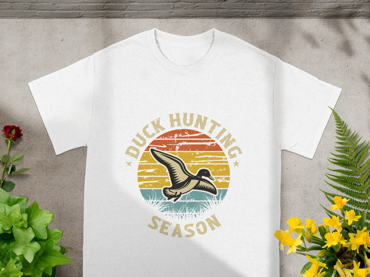 White t-shirt with "Duck Hunting Season" text and flying duck graphic.