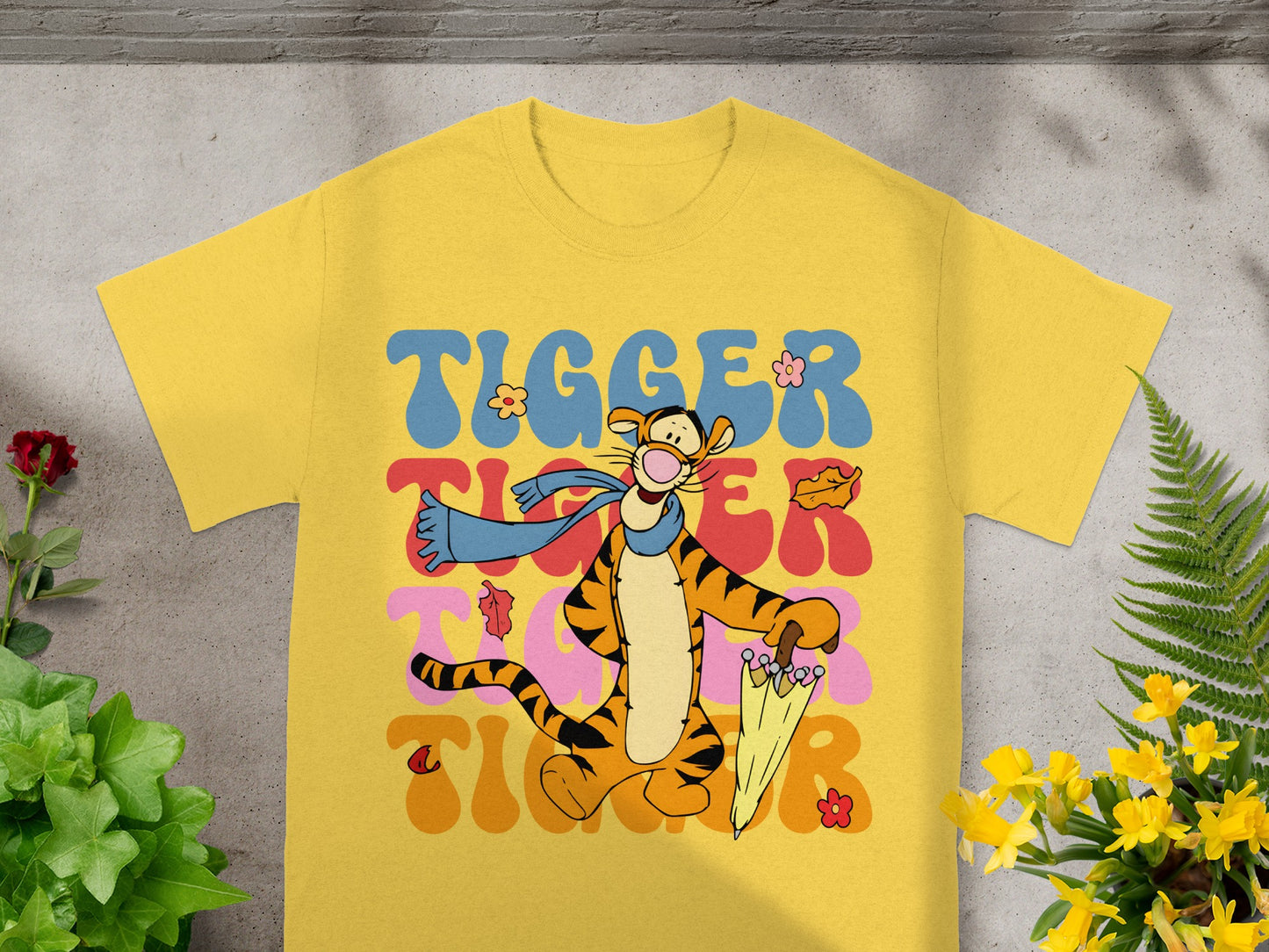 Yellow t-shirt with Tigger character and wavy "Tigger" text.