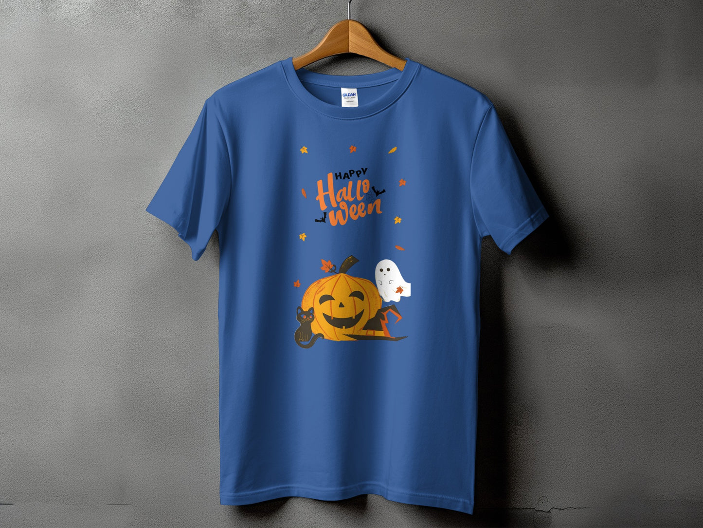 Blue t-shirt with Halloween graphic featuring pumpkin, cat, ghost, and text.