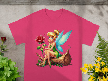 Pink t-shirt with a fairy sitting on a log holding a rose.