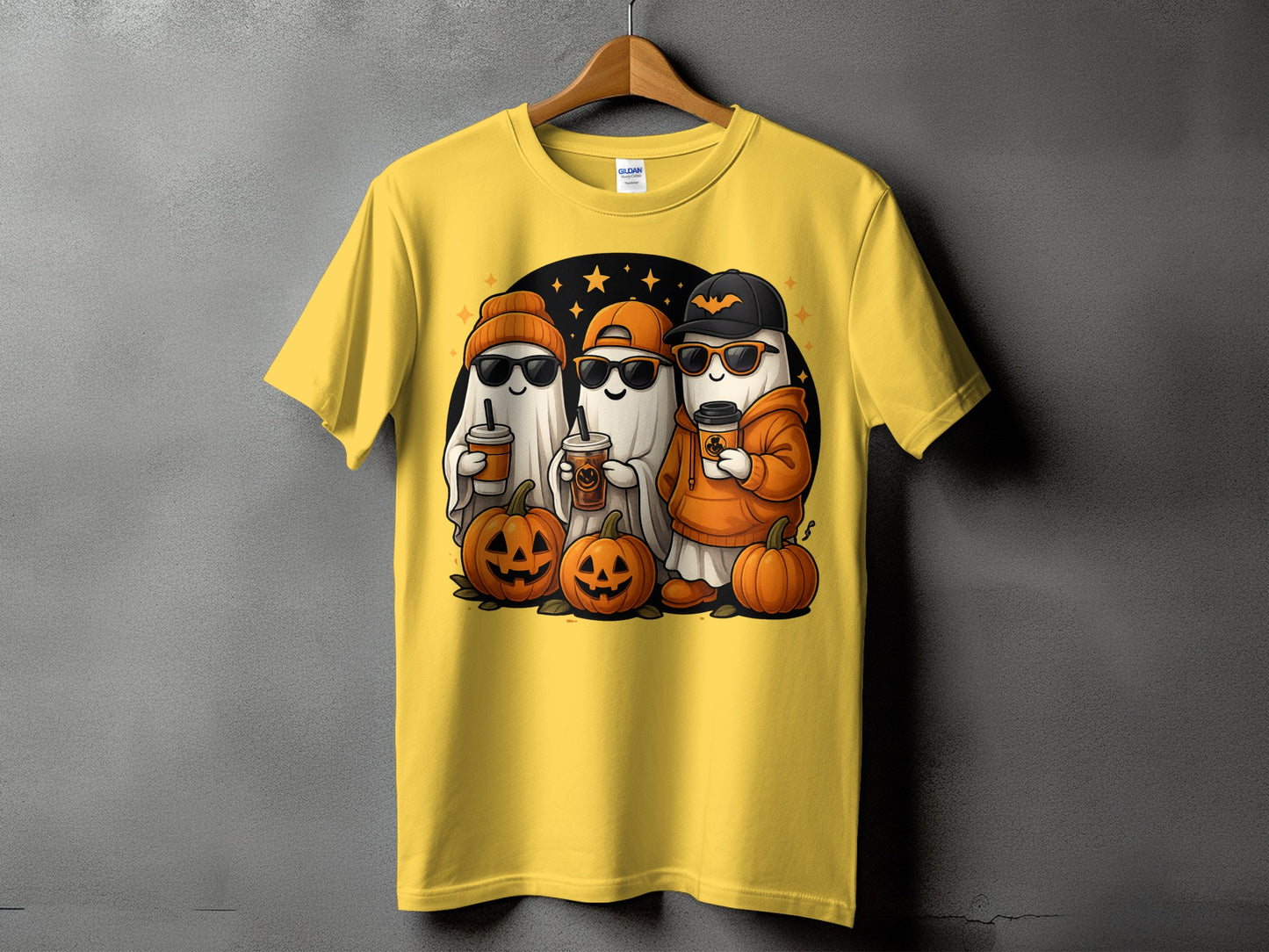 Yellow t-shirt with graphic of three ghosts, pumpkins, and coffee cups.