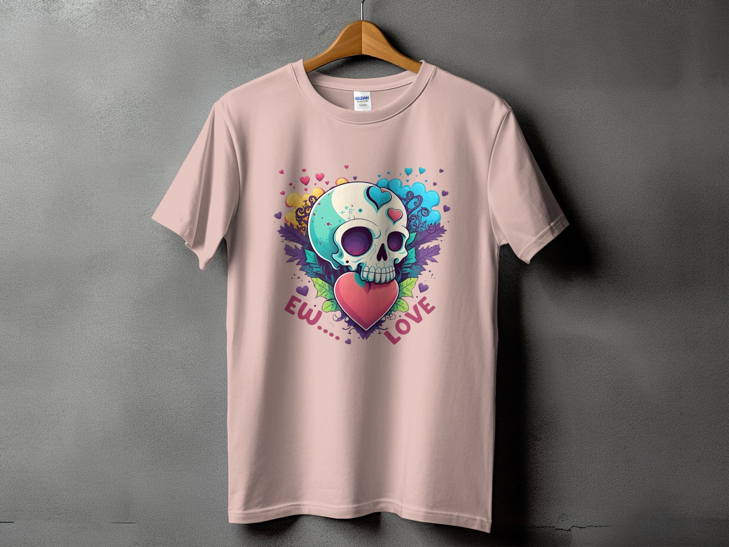 Pink t-shirt with a skull graphic holding a heart and the words "Ew... Love".