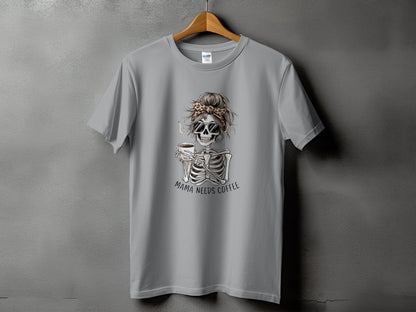 Grey t-shirt with skeleton graphic holding coffee, text "Mama Needs Coffee."