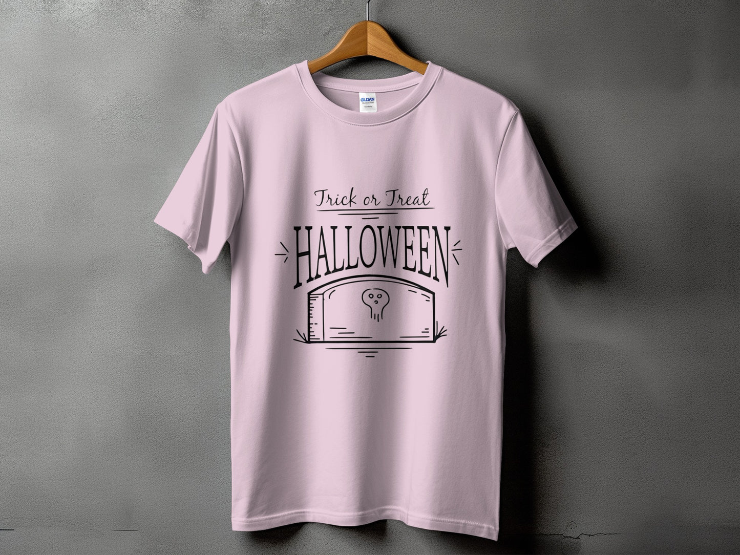 Pink t-shirt with "Trick or Treat Halloween" text and tombstone graphic.