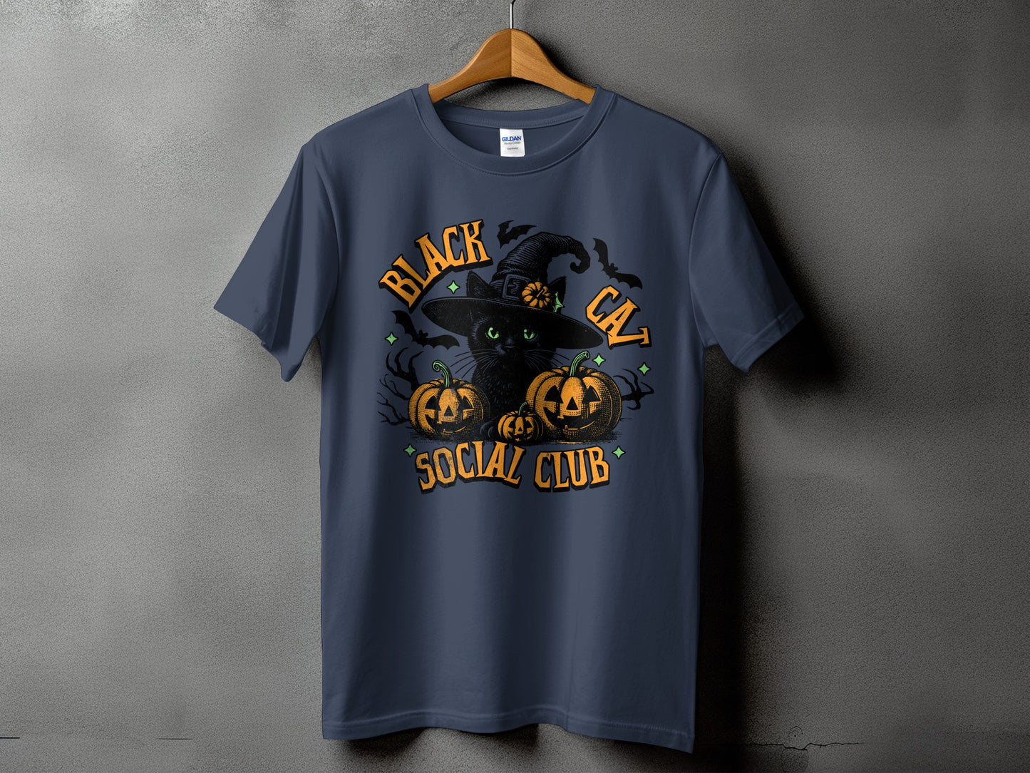 Black cat wearing a witch hat with pumpkins and bats, text says "Black Cat Social Club".