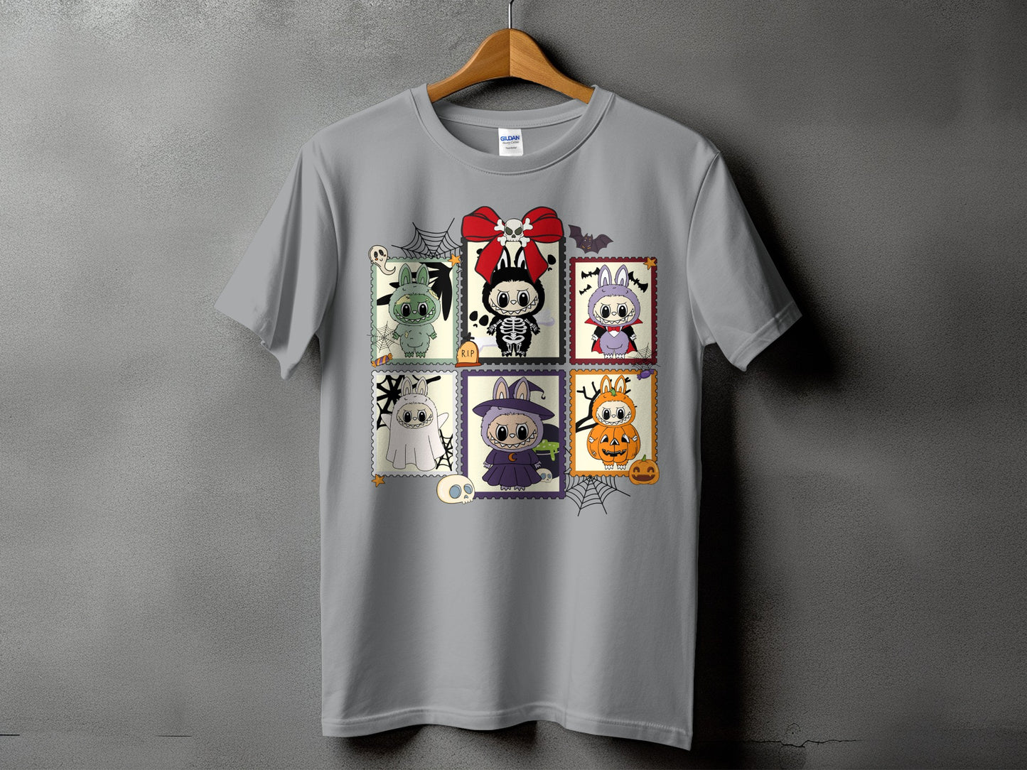 Gray t-shirt with six Halloween-themed stamp designs featuring cute characters.