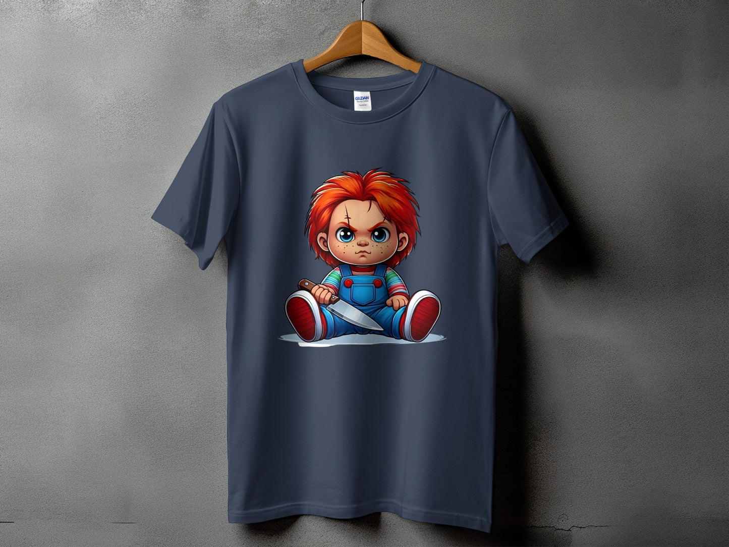 Chucky doll graphic on a dark blue t-shirt with a knife.