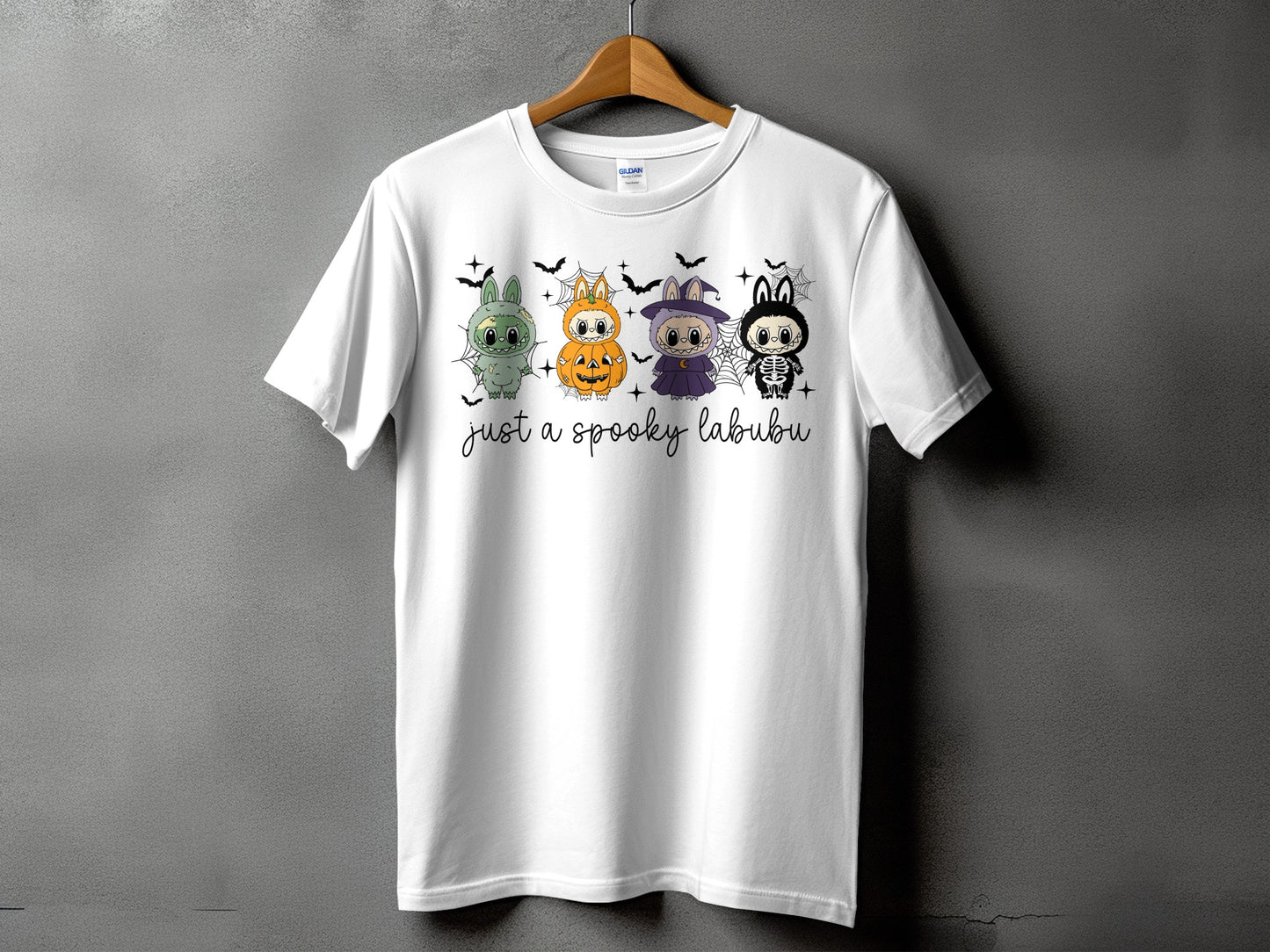 White t-shirt with "just a spooky labubu" text and four Halloween-themed characters.
