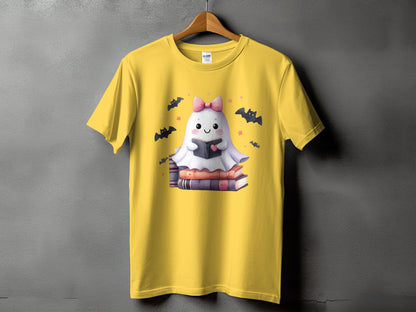 Yellow t-shirt with a cute ghost reading a book, surrounded by bats.
