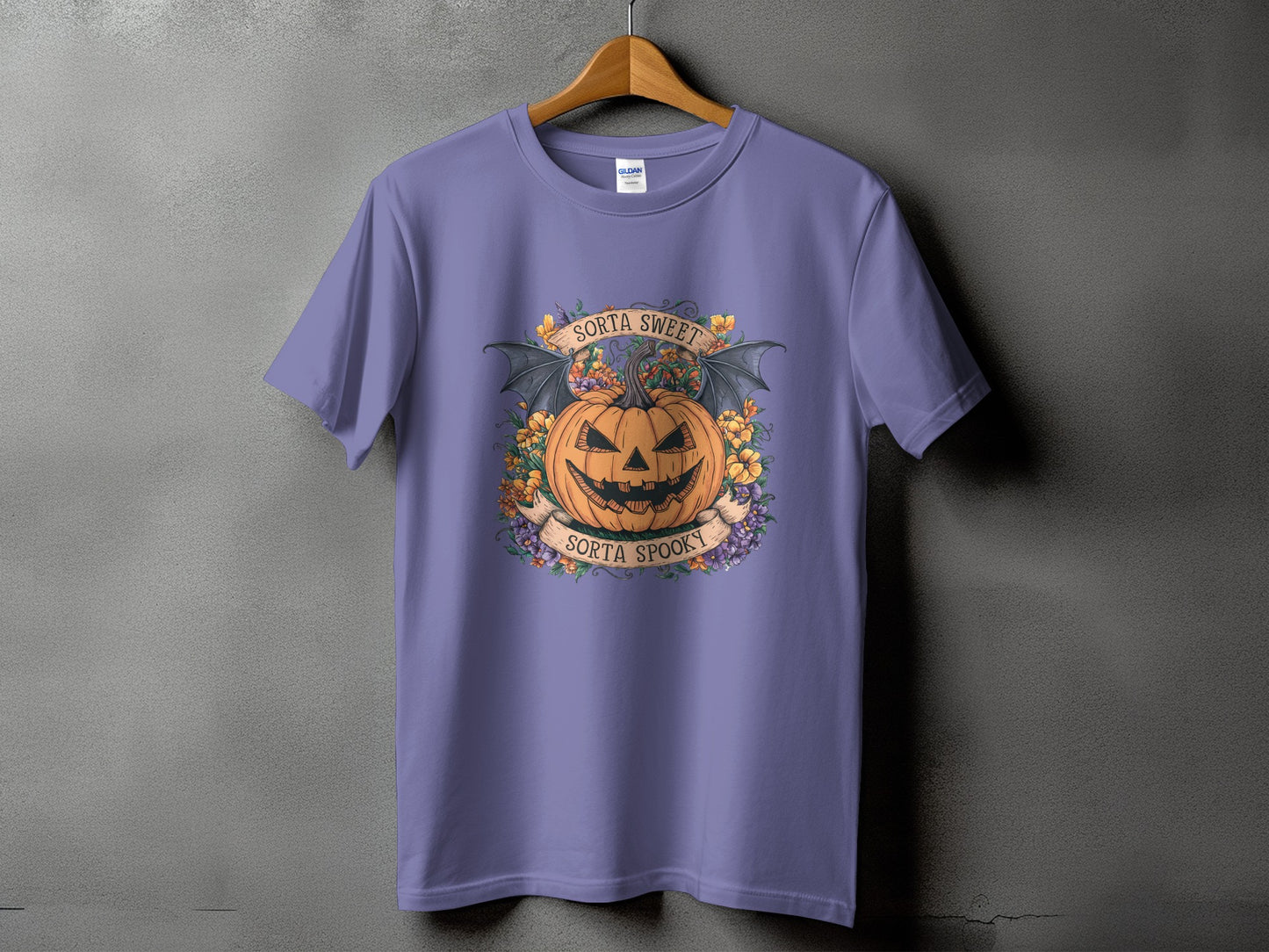 Purple t-shirt with a Halloween pumpkin graphic and text "Sorta Sweet" and "Sorta Spooky".