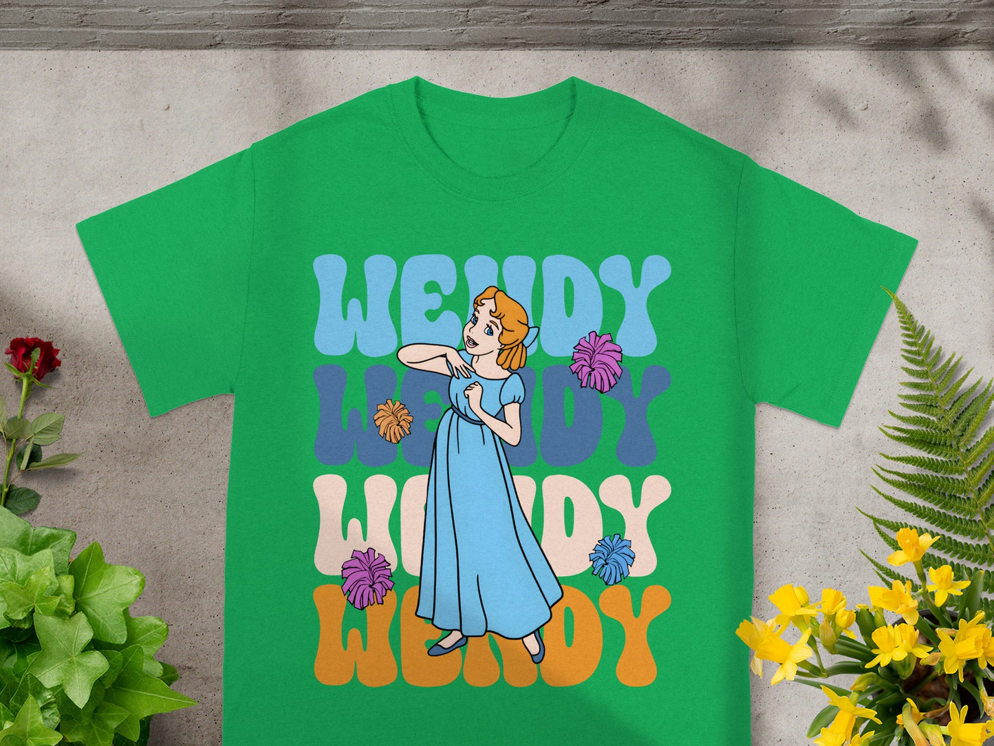 Green t-shirt with "WENDY" in colorful text and a cartoon woman.