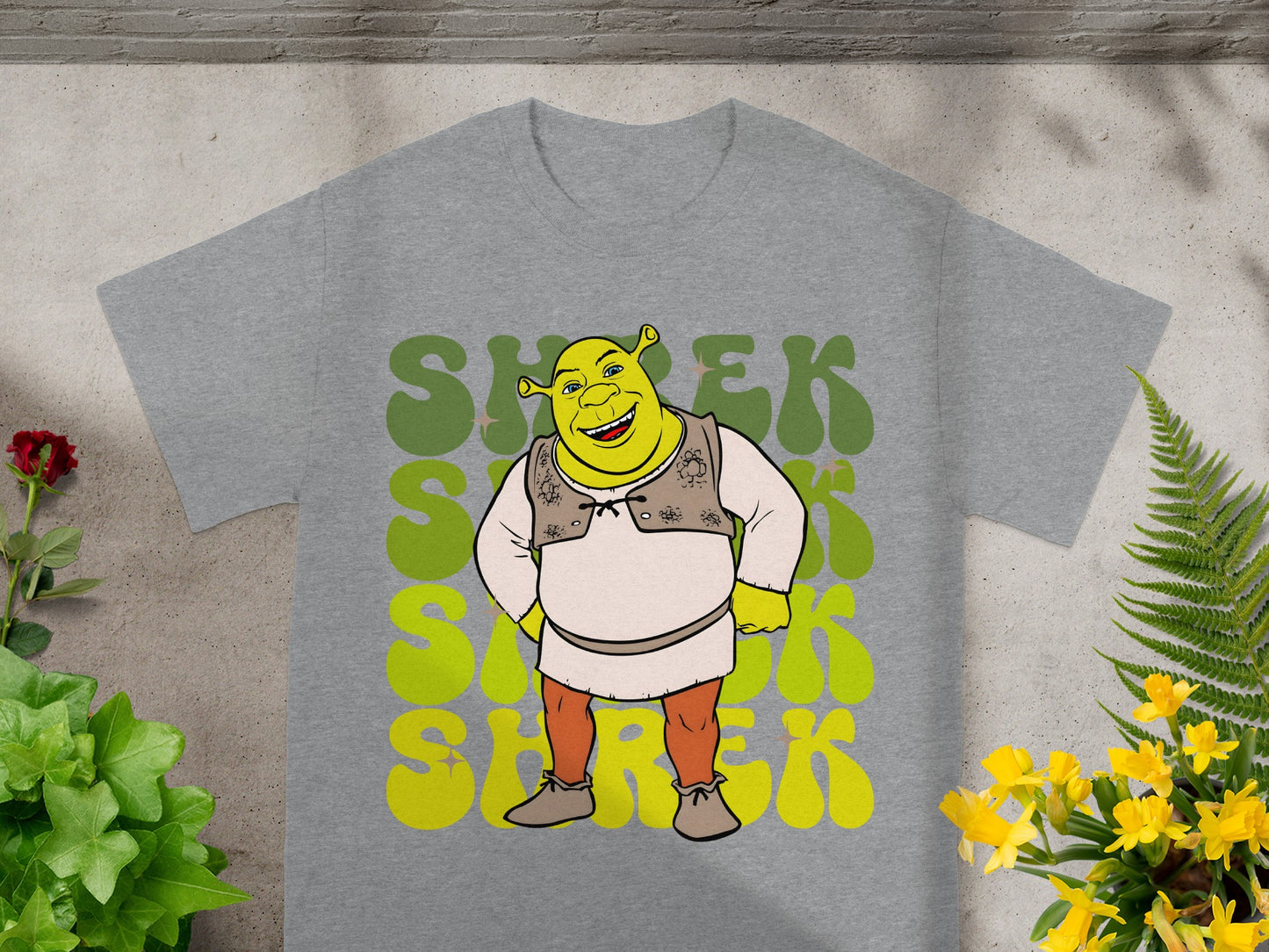 Shrek character graphic on grey t-shirt with repeating green text.