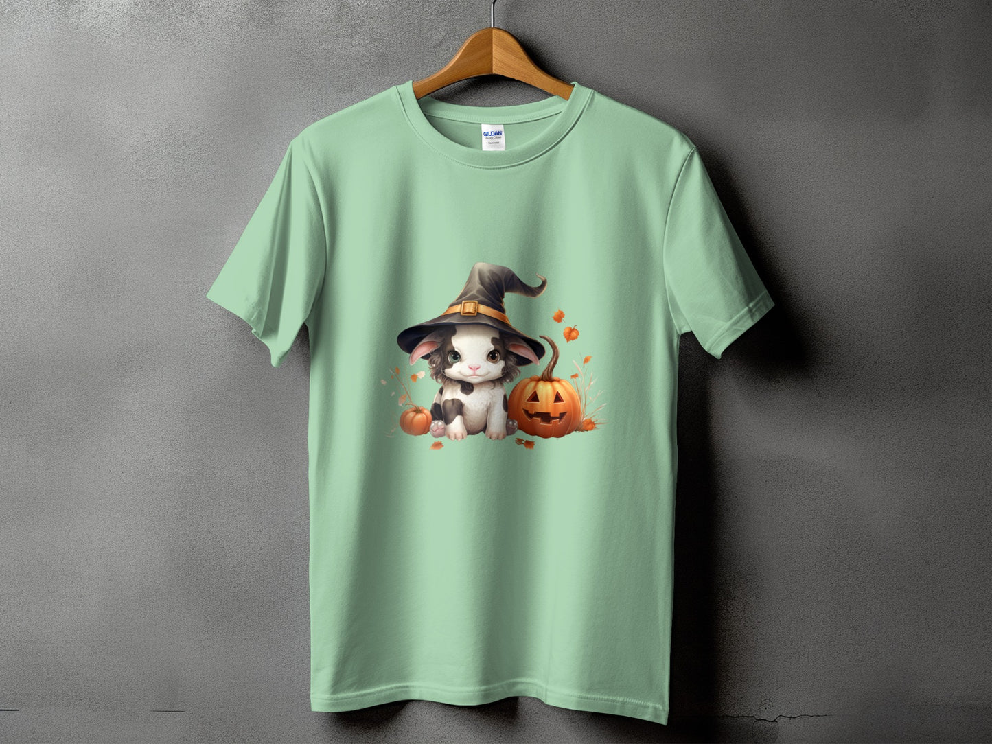 Light green t-shirt with a cute bunny in a witch hat and pumpkins graphic.