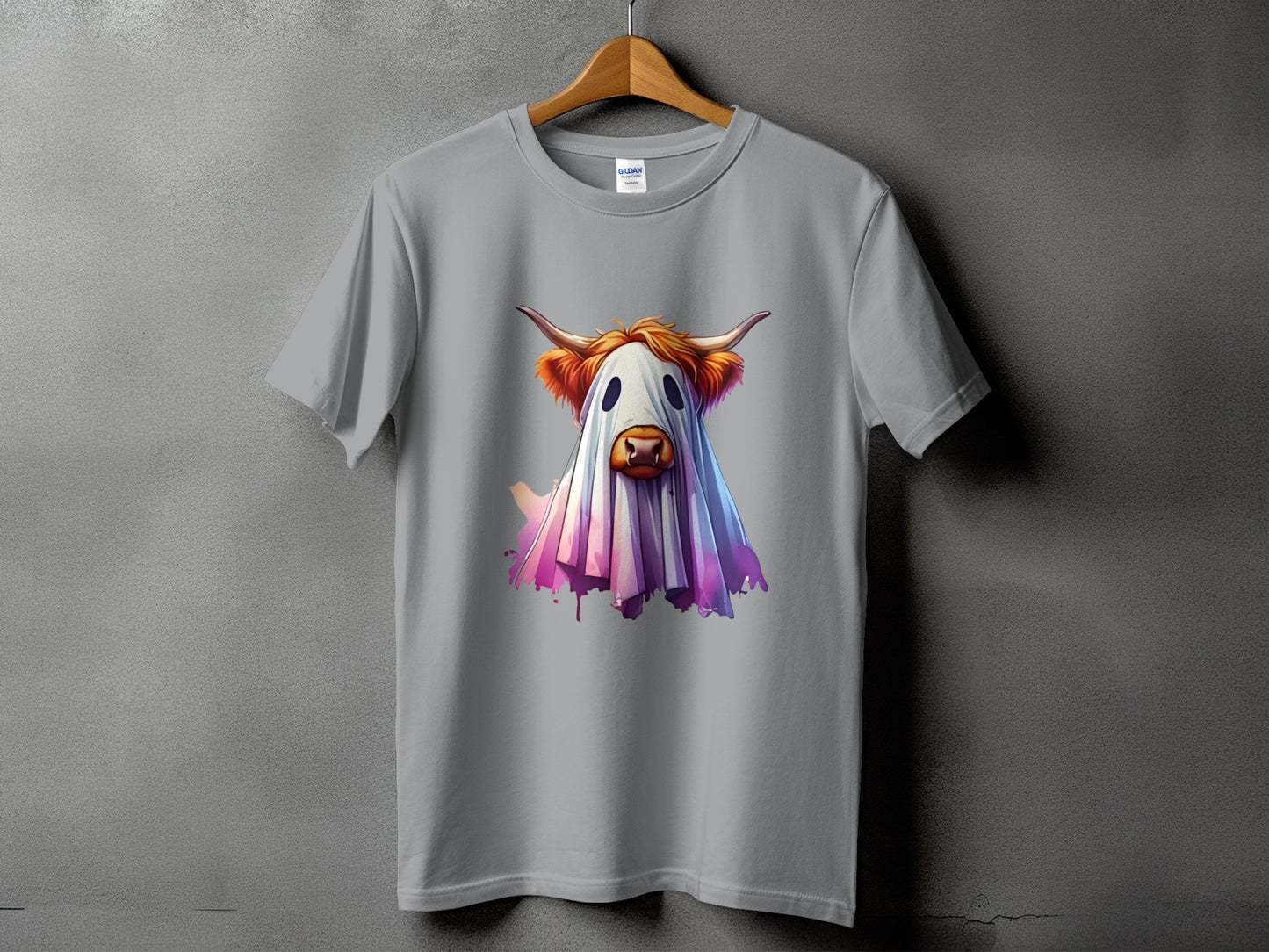 Grey t-shirt with a watercolor ghost cow design in pink and purple hues.