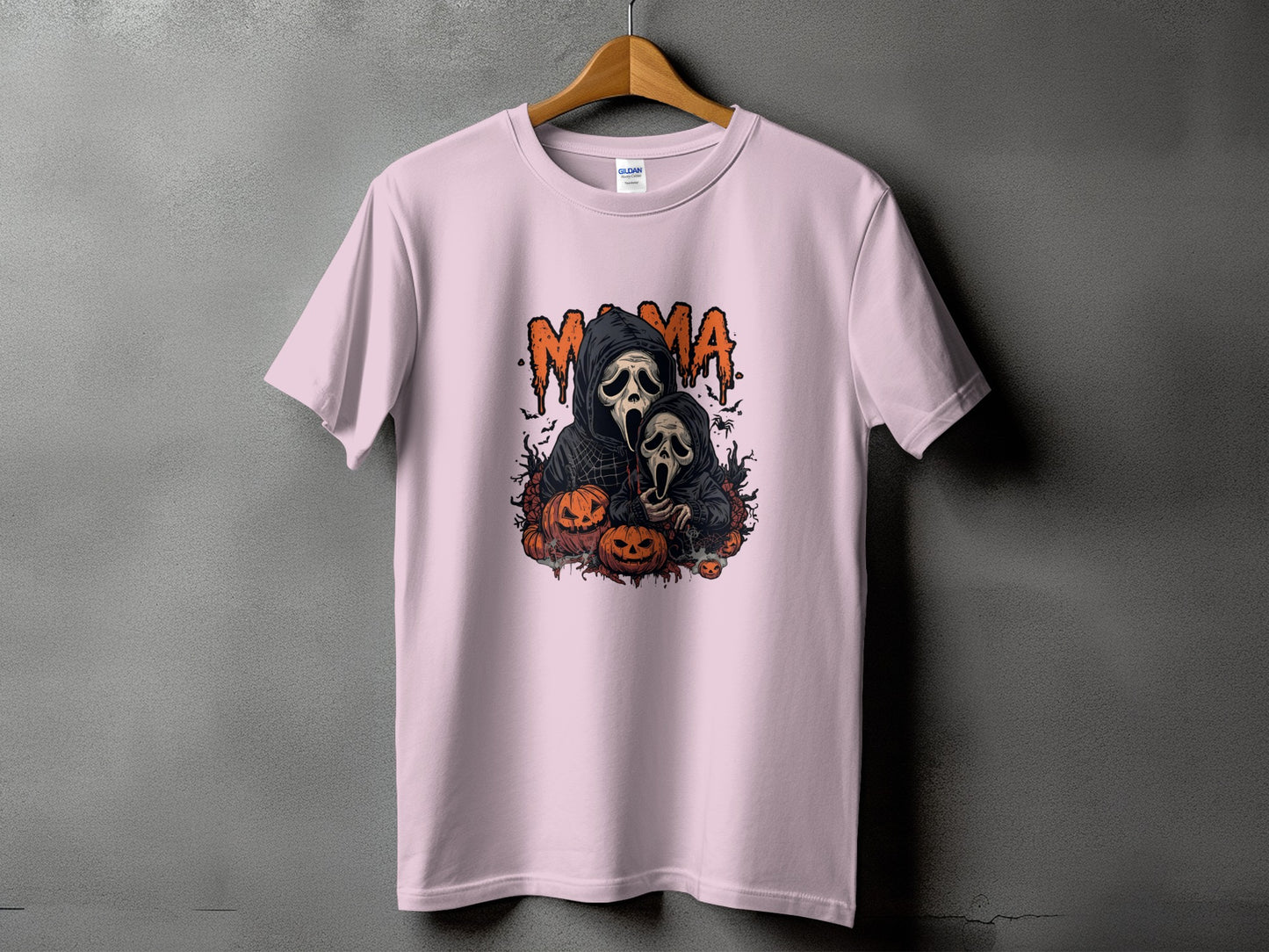 Pink t-shirt with "Mama" text and ghost figures surrounded by pumpkins.