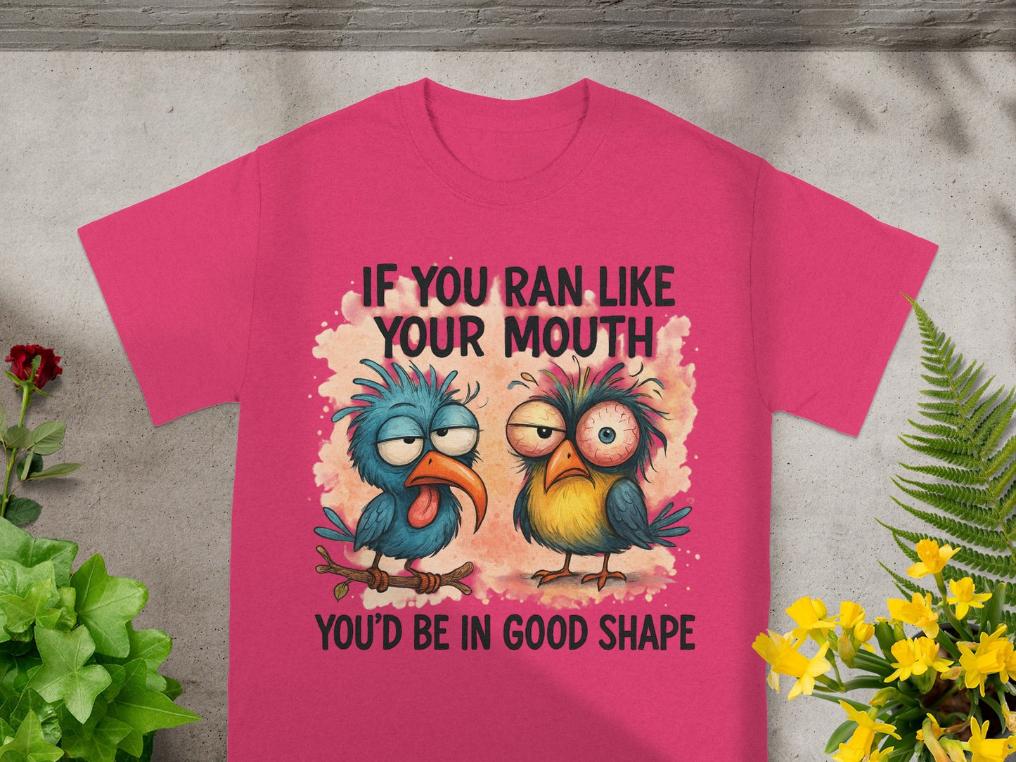 Pink t-shirt with cartoon birds and text "If you ran like your mouth, you'd be in good shape."