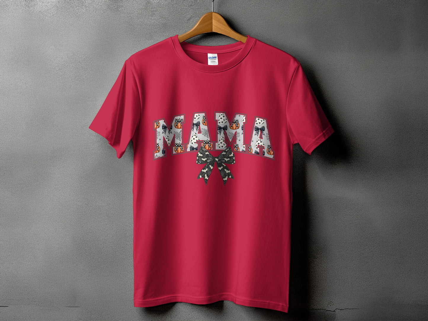 Red t-shirt with "Mama" in Halloween-themed letters and a bat bow.