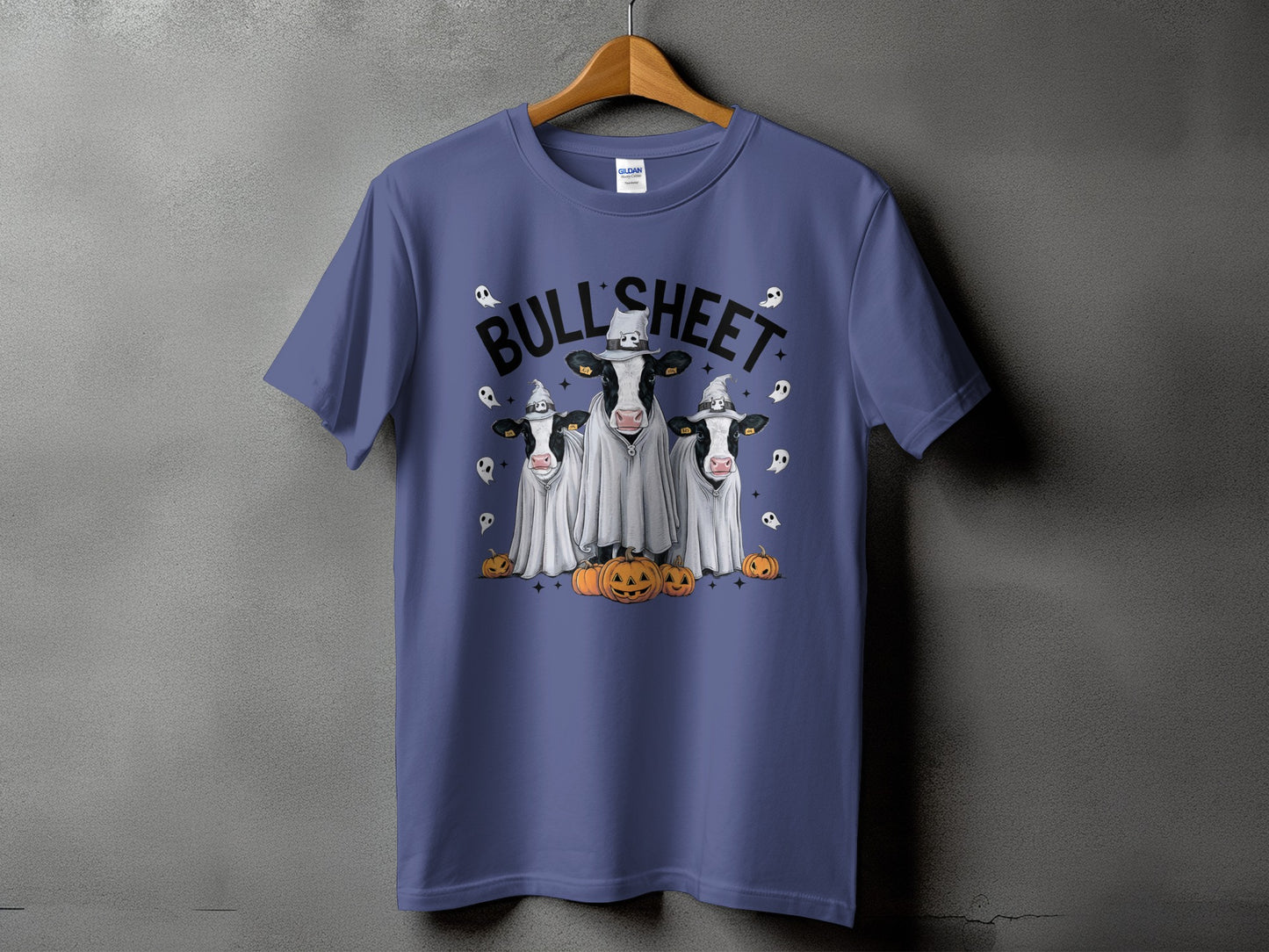 Three cows in ghost costumes with pumpkins and ghosts, "Bull Sheet" text.