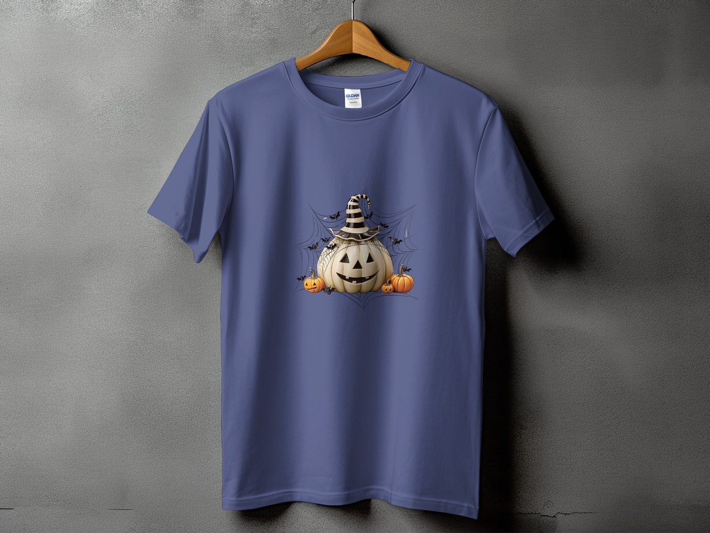 Purple t-shirt with a Halloween graphic of a jack-o'-lantern wearing a witch hat.