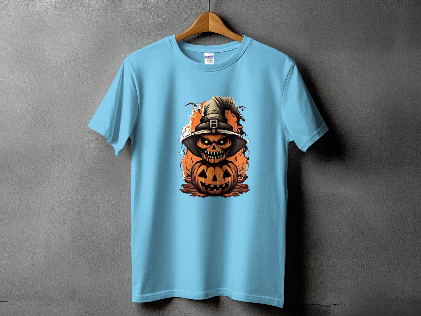 Light blue t-shirt with a stacked Halloween jack-o'-lantern and witch hat design.