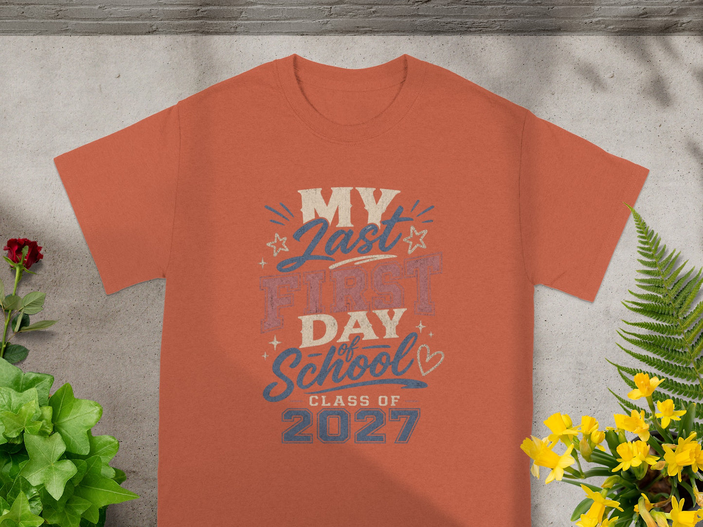 Orange t-shirt with "My Last First Day of School Class of 2027" graphic.