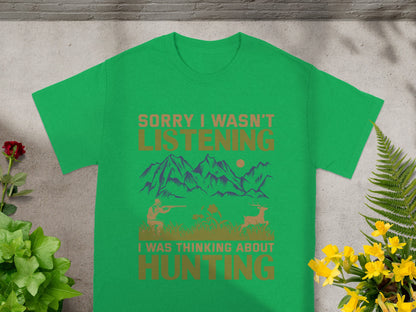 Green t-shirt with text "Sorry I wasn't listening" and a hunting graphic.