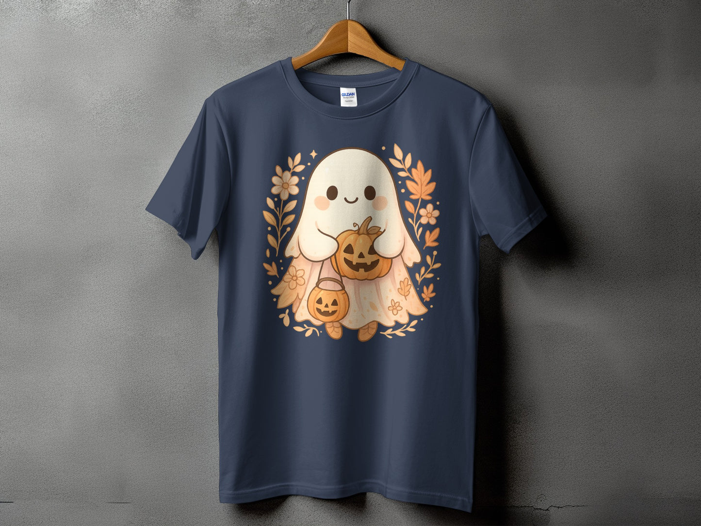 Navy t-shirt with a cute ghost holding pumpkins and surrounded by floral accents.
