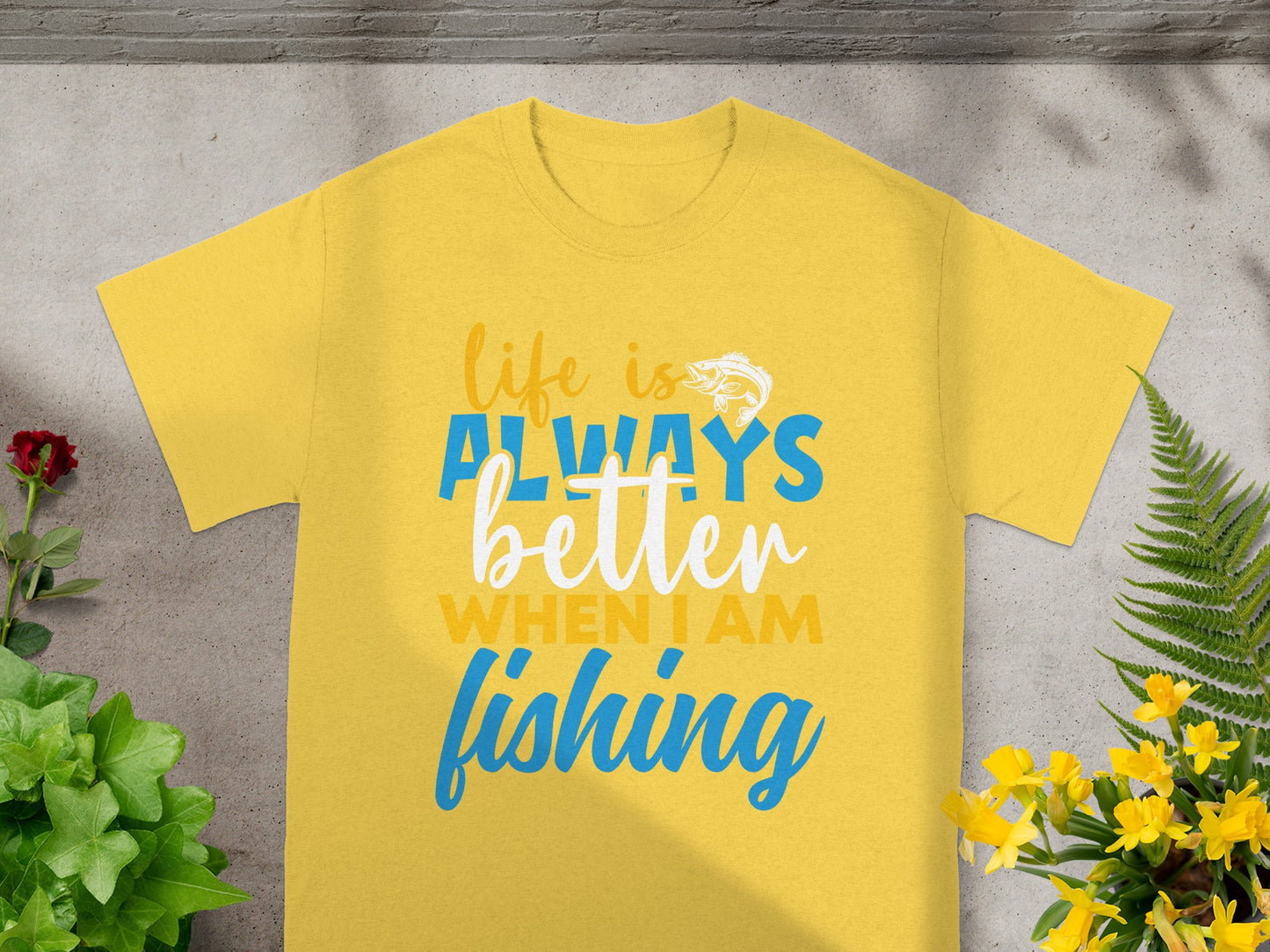 Yellow t-shirt with text "life is ALWAYS better WHEN I AM fishing" and fish graphic.