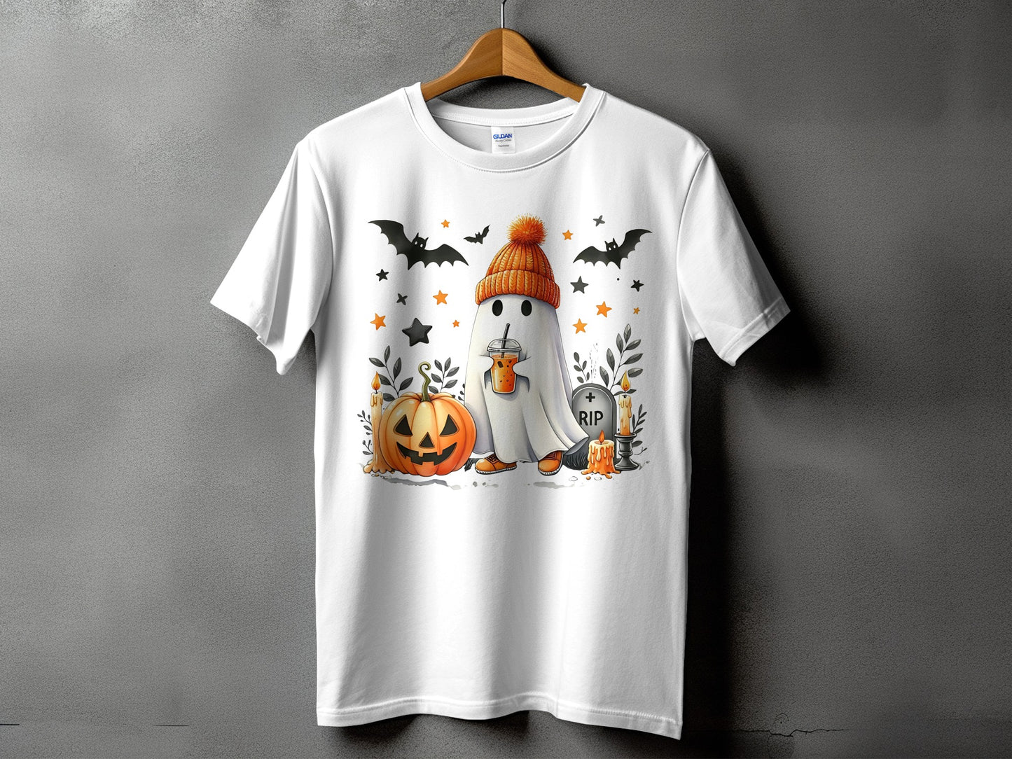 White t-shirt with Halloween ghost, pumpkin, bats, and RIP tombstone graphic.