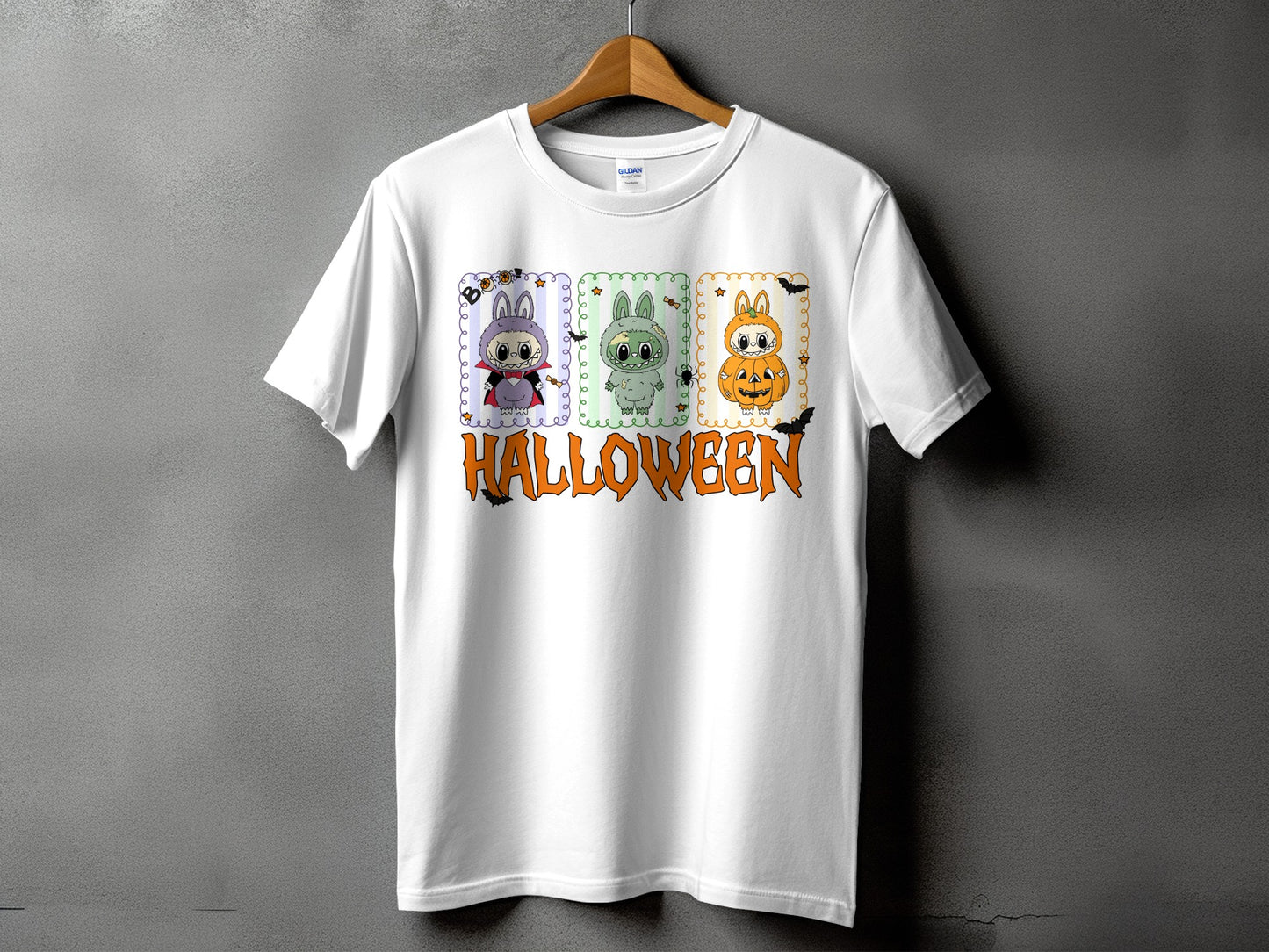 White t-shirt with Halloween graphic featuring three cartoon characters and text.