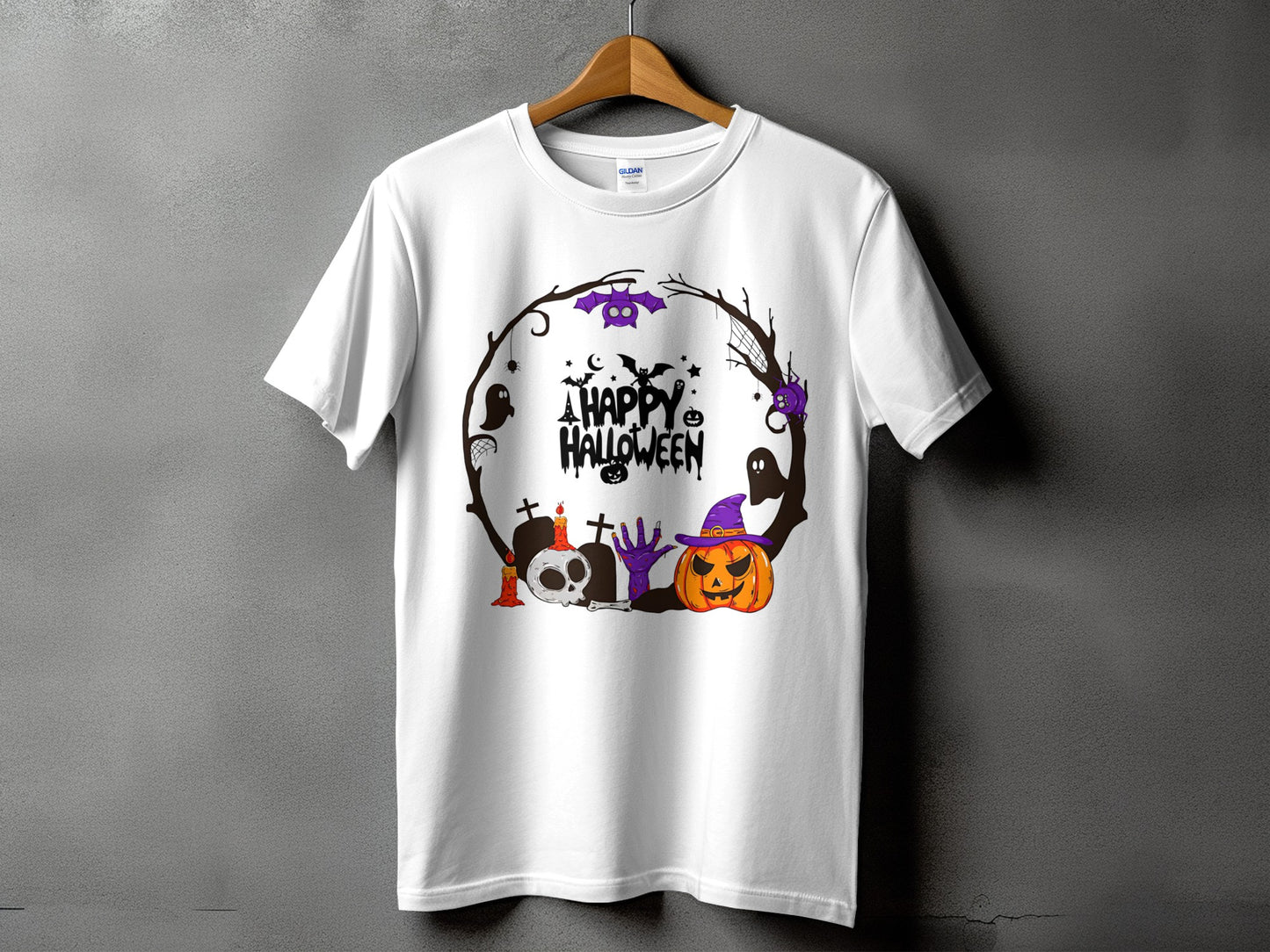 White t-shirt with a circular Halloween graphic featuring a pumpkin, skull, bats, and text.