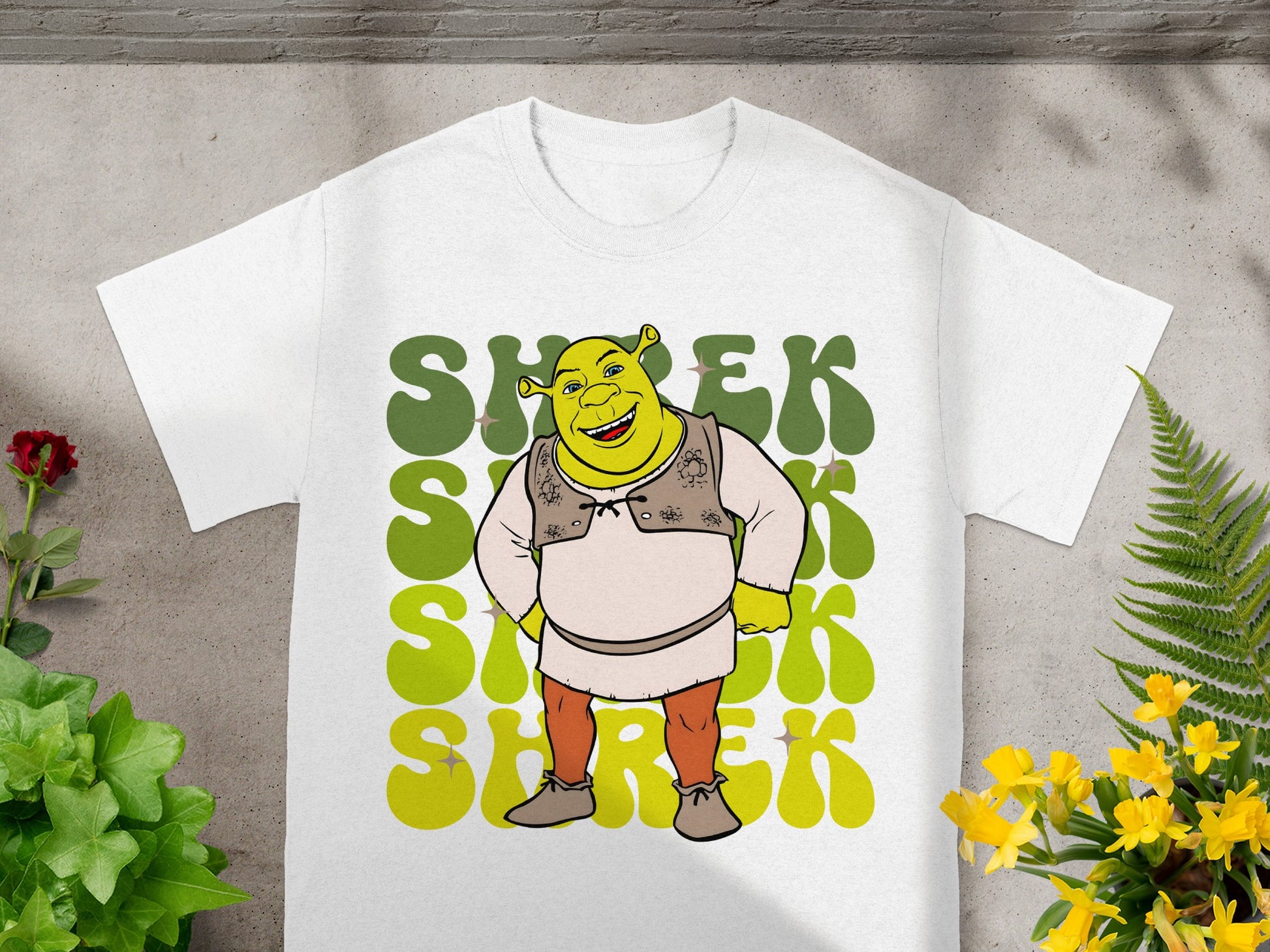 White t-shirt with Shrek character and retro green text.
