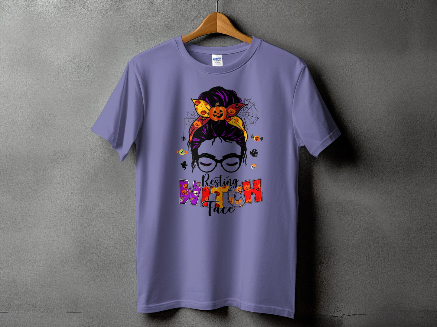 Purple t-shirt with Halloween graphic of a woman with messy bun and "Resting Witch Face" text.