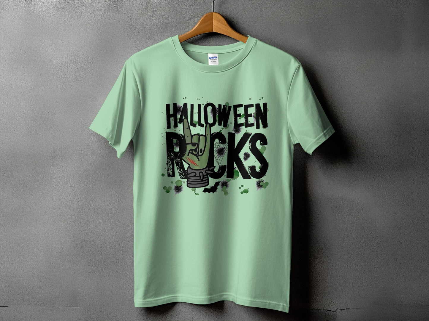 Pale green t-shirt with "Halloween Rocks" text and a zombie hand.