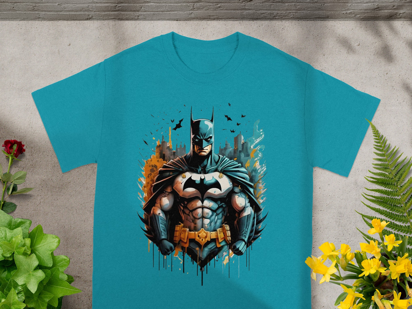 Blue t-shirt with muscular Batman graphic against a cityscape background.