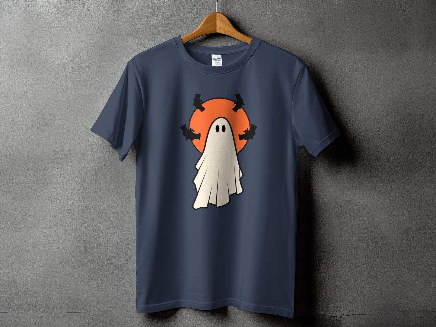 Navy t-shirt with a white ghost and black bats on an orange circle.