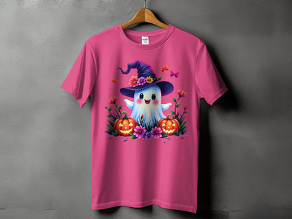 Pink t-shirt with a cute ghost wearing a witch hat, surrounded by pumpkins and flowers.