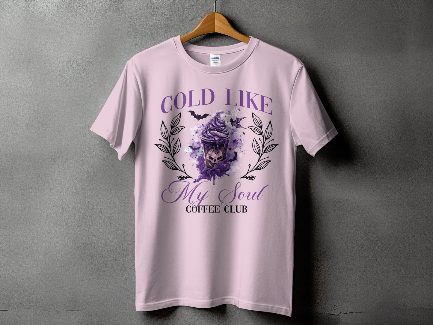 Light pink t-shirt with "Cold Like My Soul Coffee Club" text and spooky drink graphic.