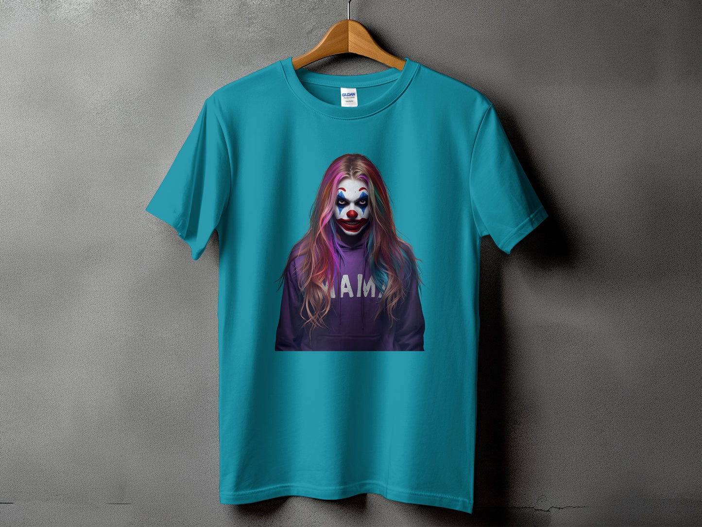 Teal t-shirt with clown face and "MA" text graphic on purple hoodie.