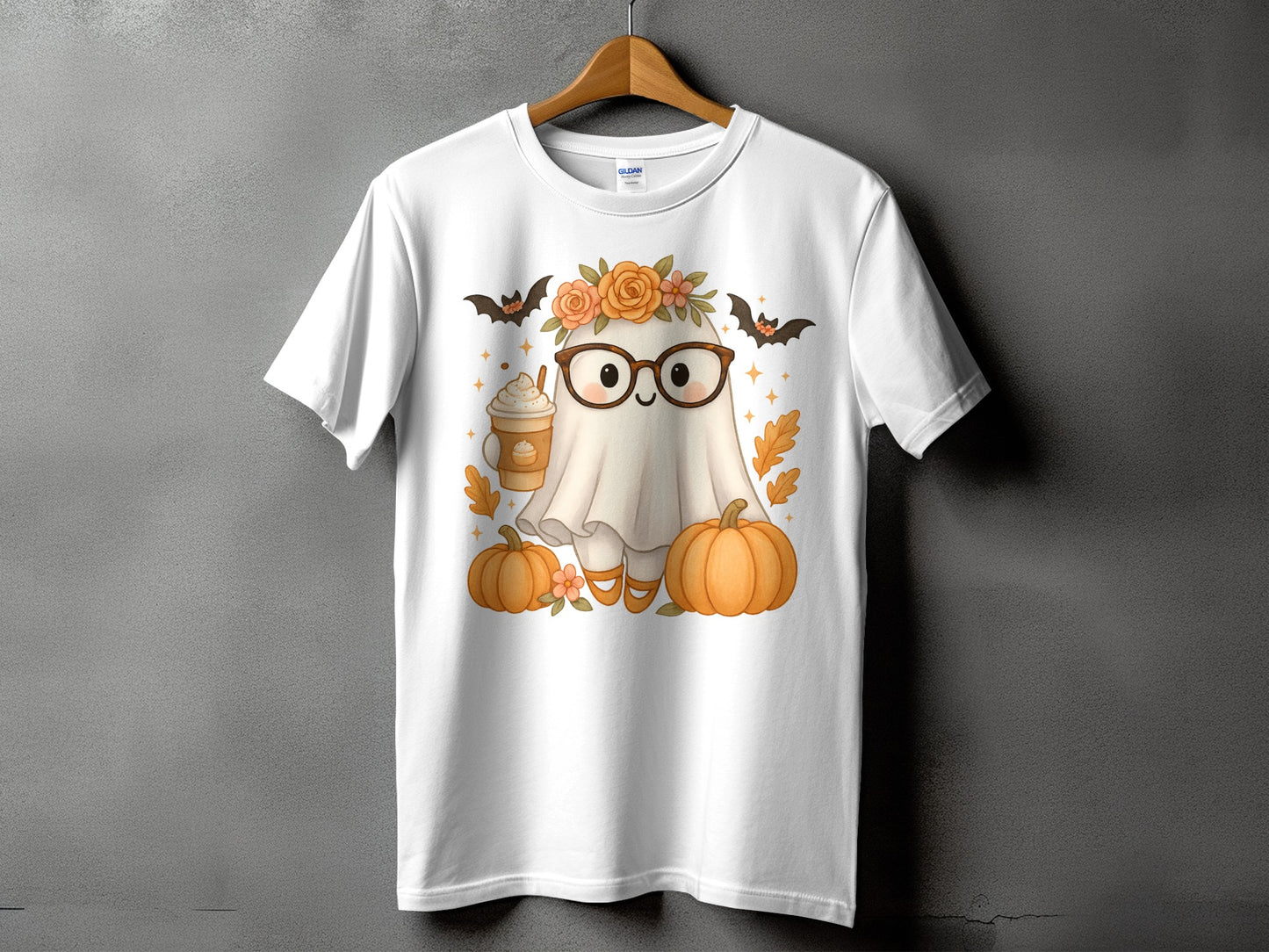White t-shirt with a cute ghost wearing glasses, flowers, and holding a coffee cup.