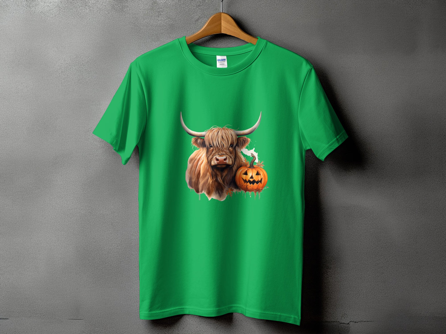 Green t-shirt with Highland cow and Jack-o'-lantern Halloween graphic.
