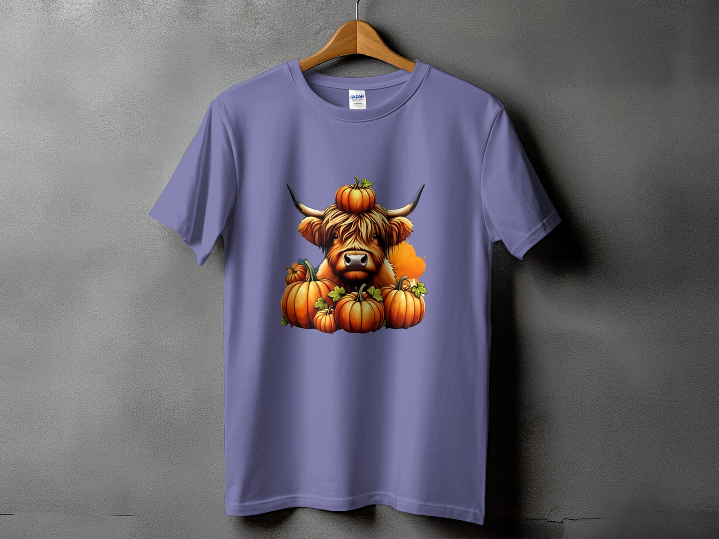 Purple t-shirt with a highland cow and pumpkins graphic.