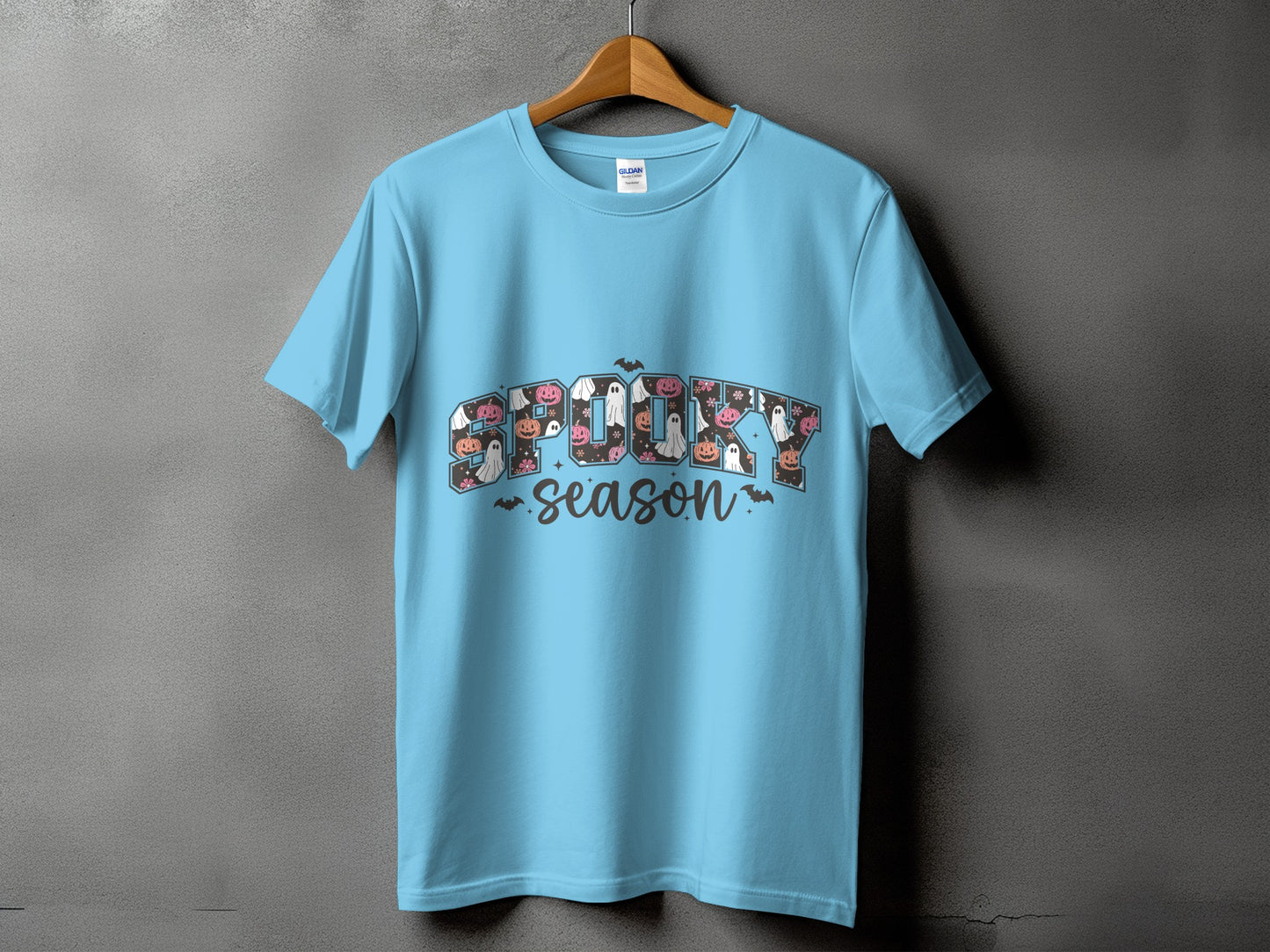 Light blue t-shirt with "Spooky Season" graphic featuring ghosts and pumpkins.