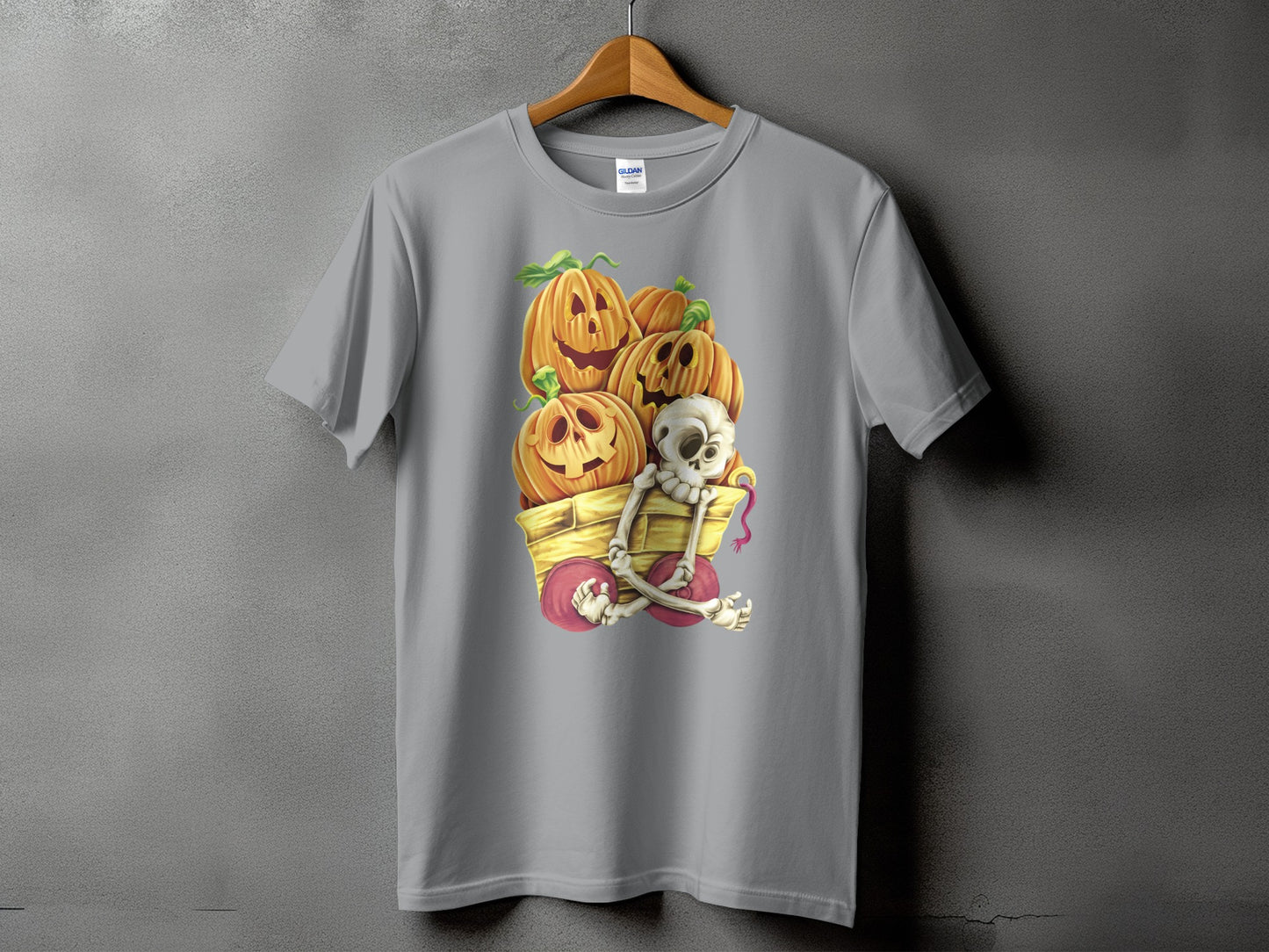 Gray t-shirt with a Halloween graphic of pumpkins and a skeleton in a cart.