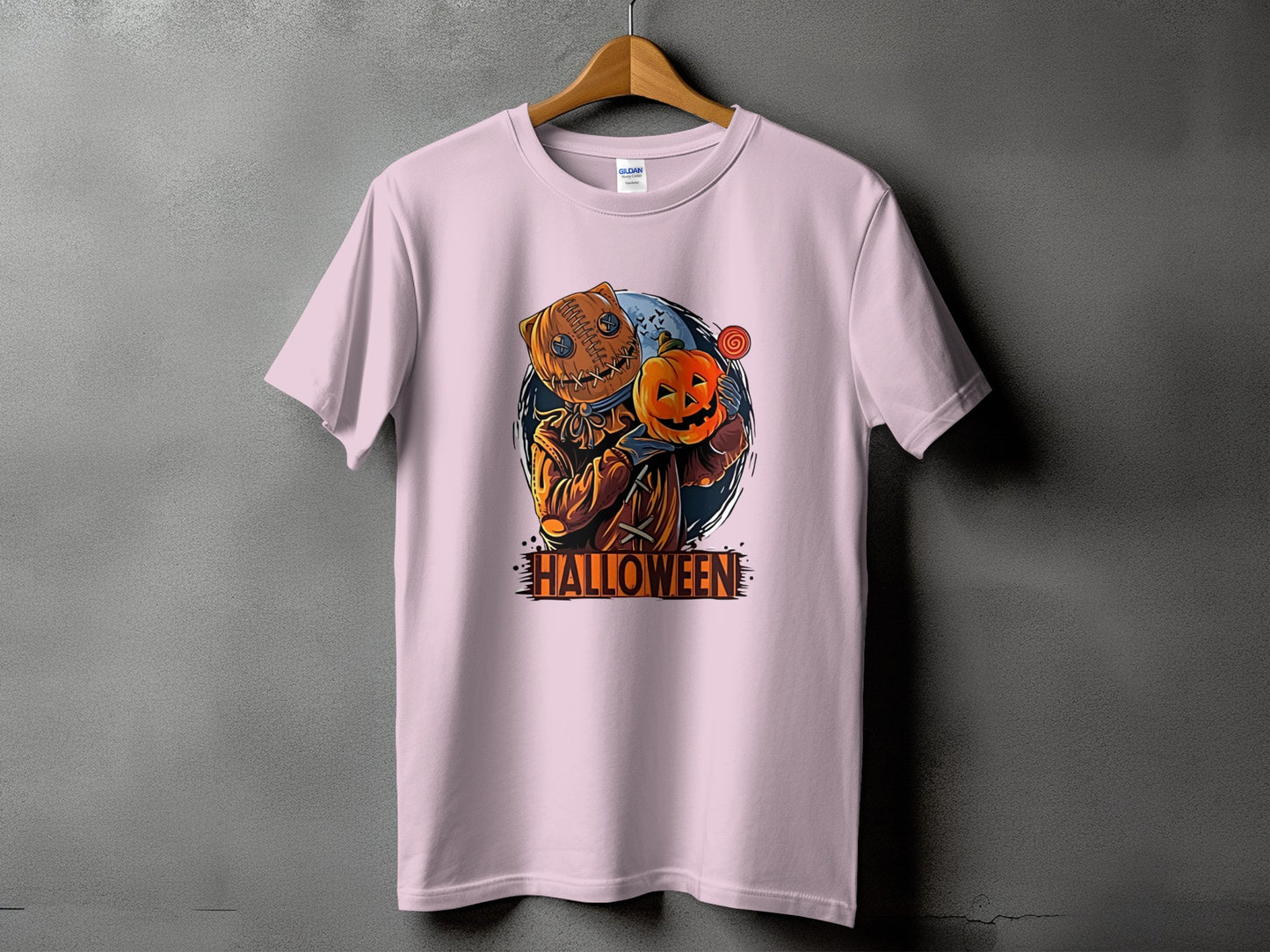 Pink t-shirt with a jack-o'-lantern character holding a pumpkin and text reading "HALLOWEEN".