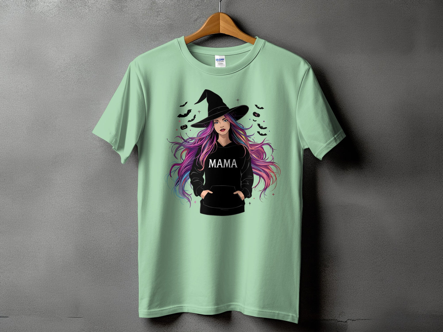 Mint green t-shirt with witch graphic and the word "MAMA"